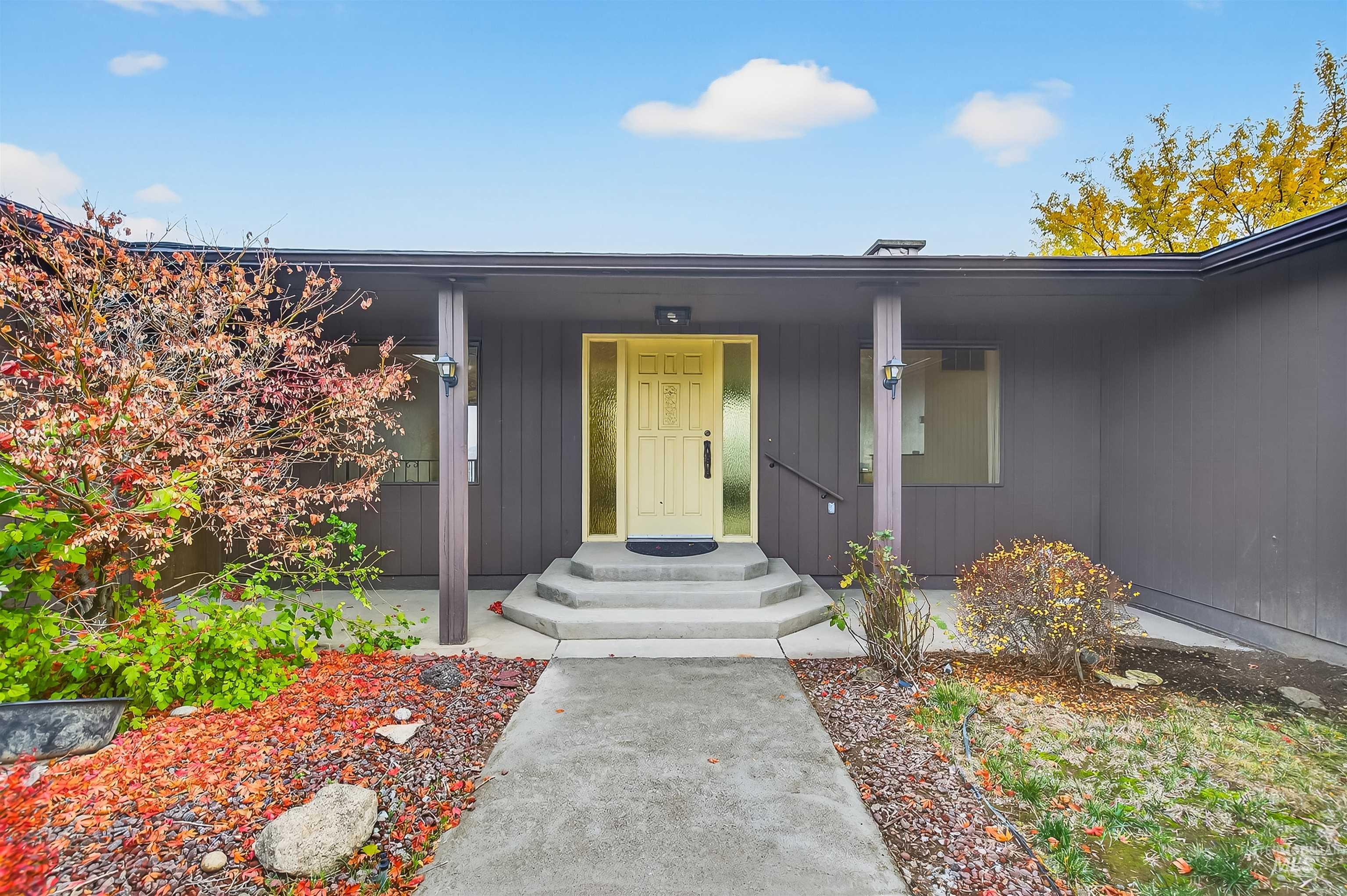 Doorway to property featuring covered porch