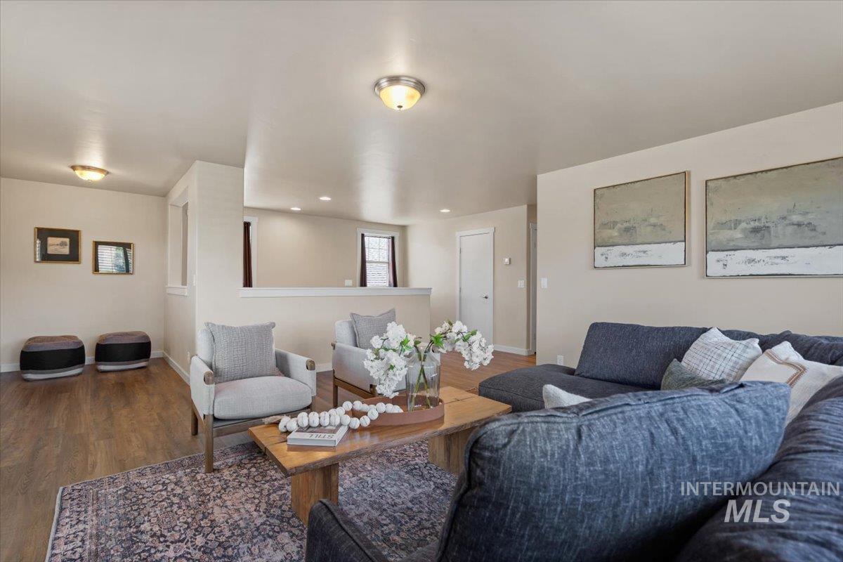 Living room with wood finished floors and baseboards