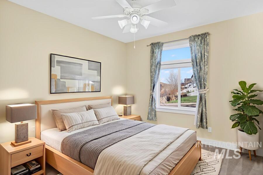 Bedroom featuring carpet floors and a ceiling fan