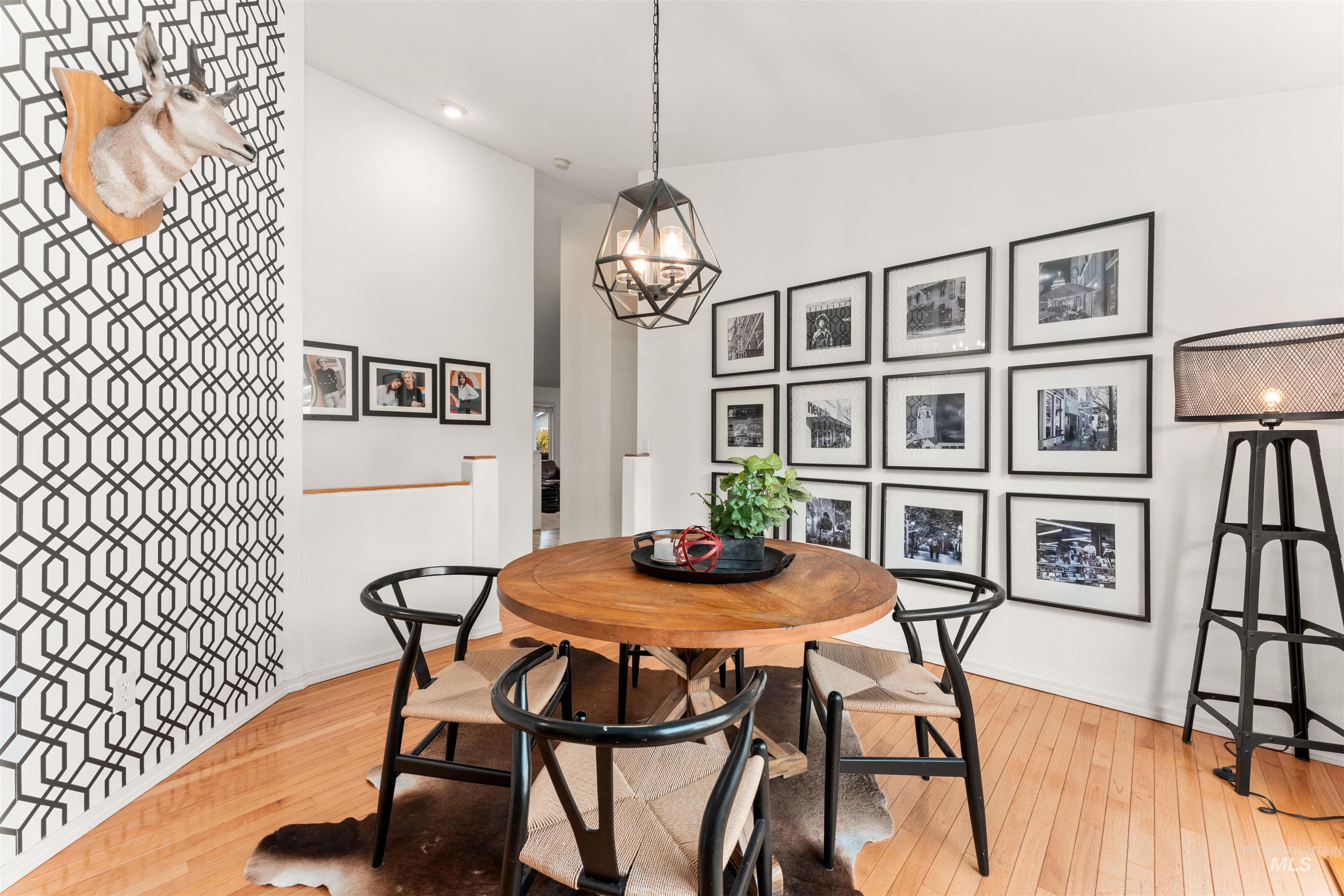 Dining room featuring light wood finished floors, a chandelier, and recessed lighting