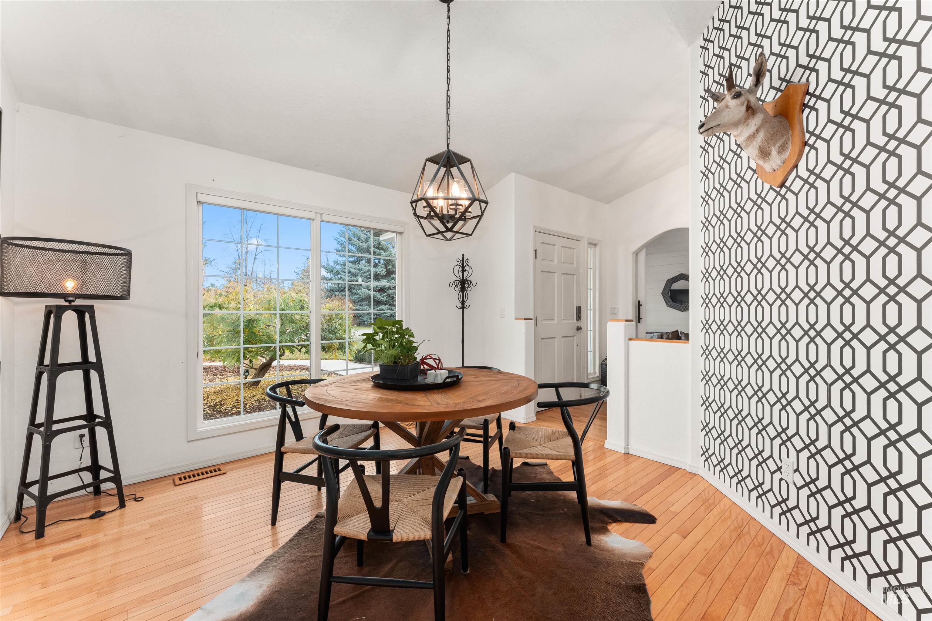 Dining space with light wood-style floors