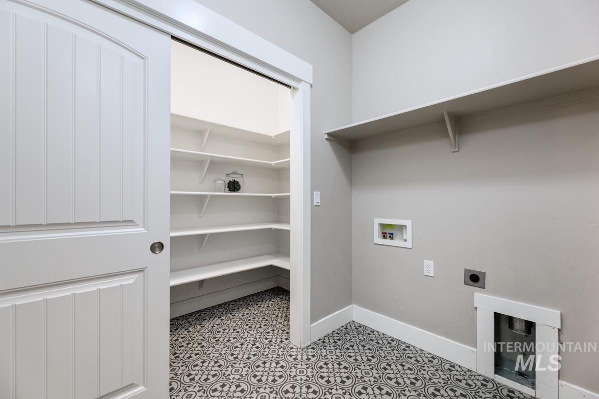 Laundry area featuring electric dryer hookup and hookup for a washing machine