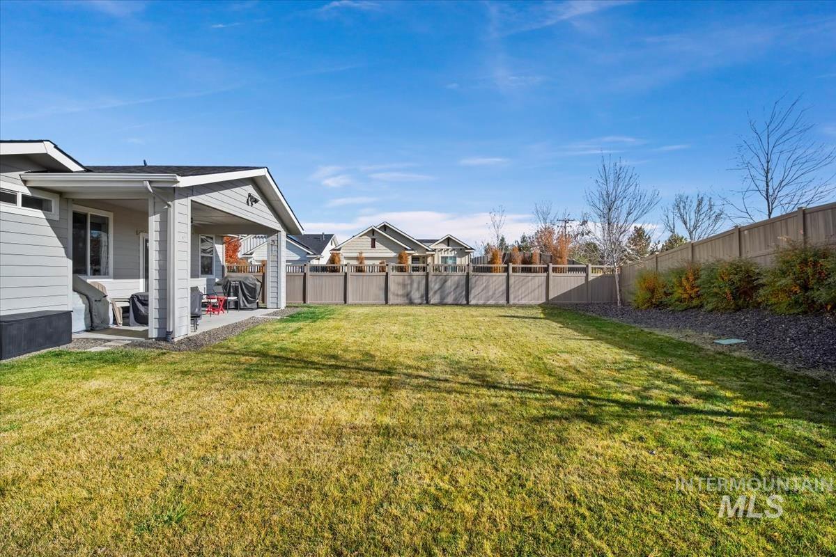 Fenced backyard featuring a patio area