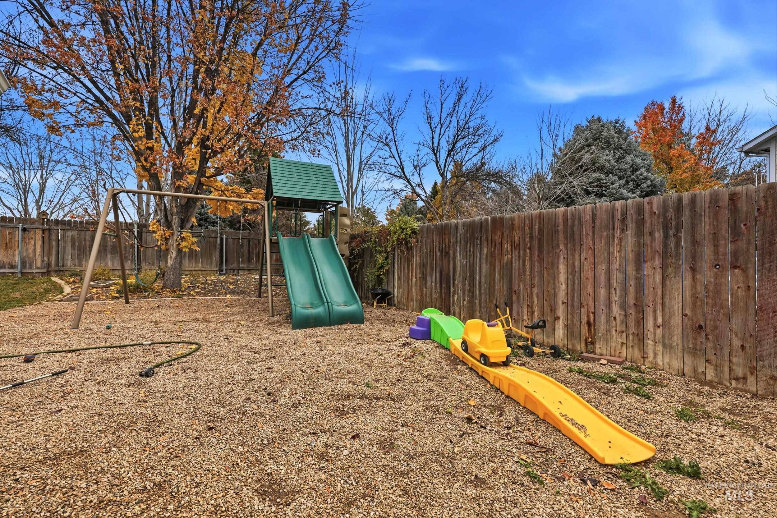 View of play area featuring a fenced backyard