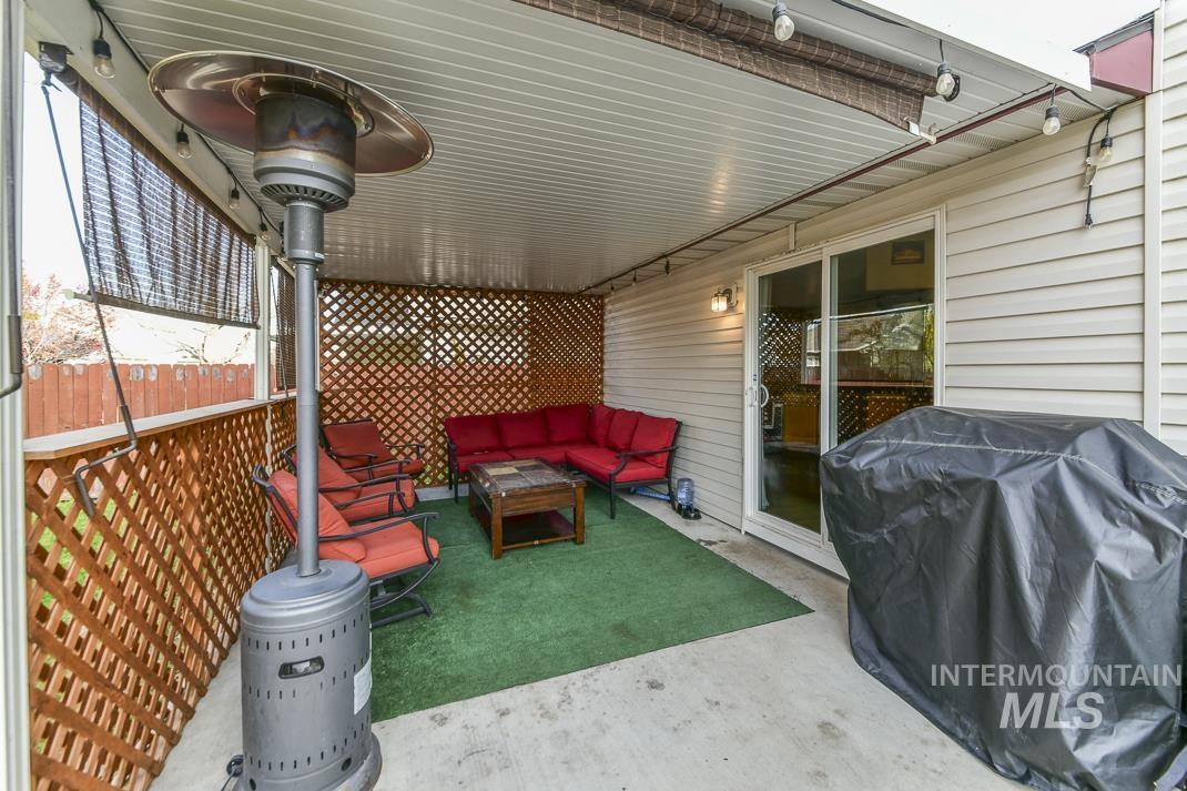 View of patio featuring area for grilling and an outdoor hangout area