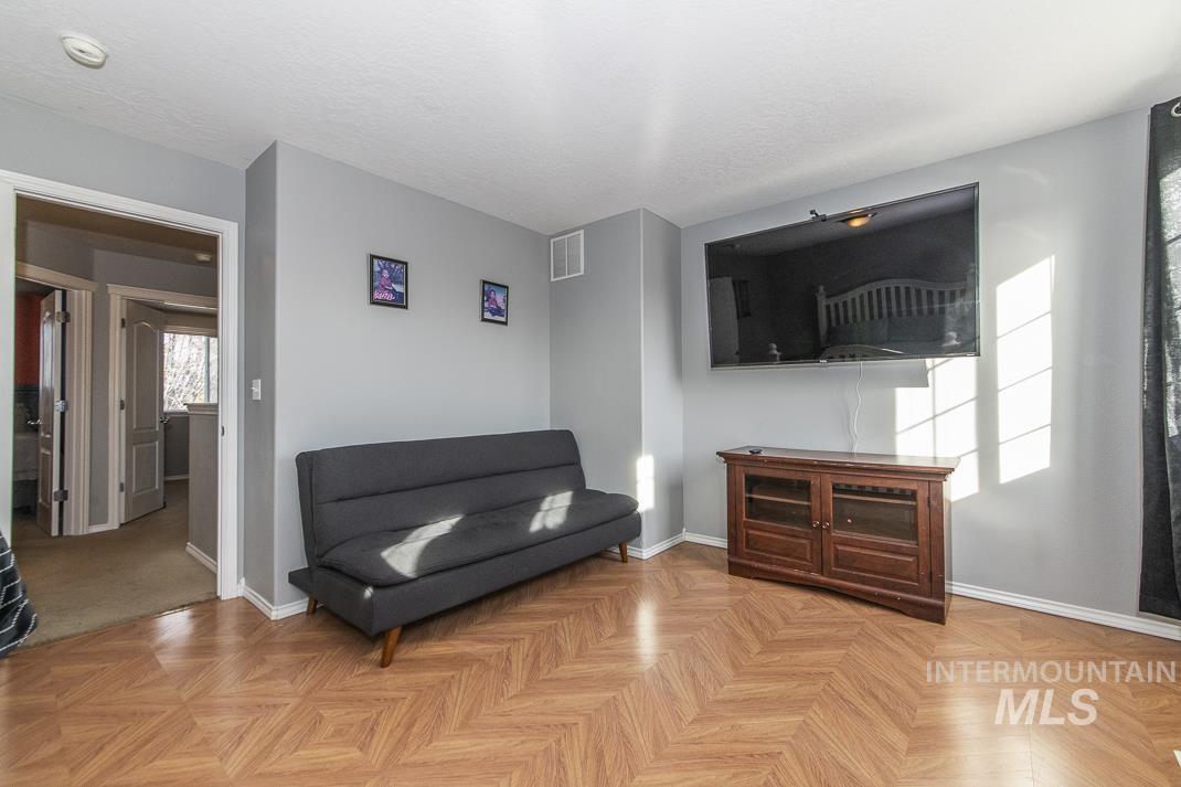 Sitting room featuring baseboards