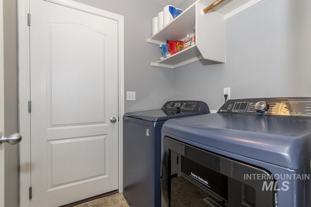 Washroom featuring washer and clothes dryer