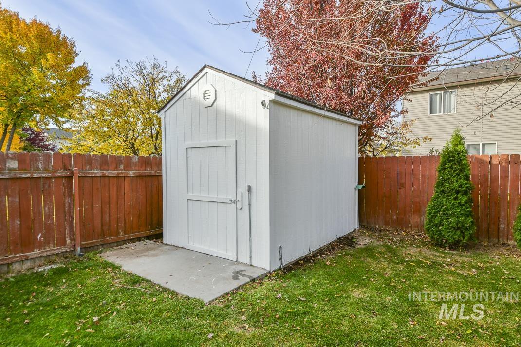 View of shed featuring a fenced backyard
