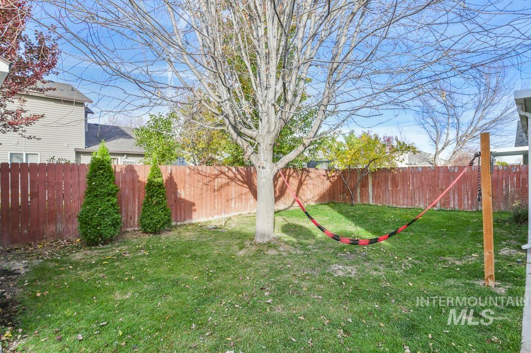 View of fenced backyard