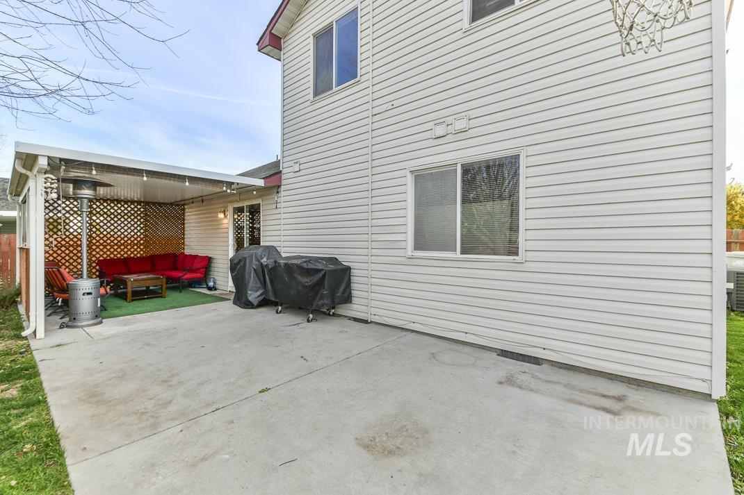 View of side of property with crawl space, a patio area, and an outdoor hangout area
