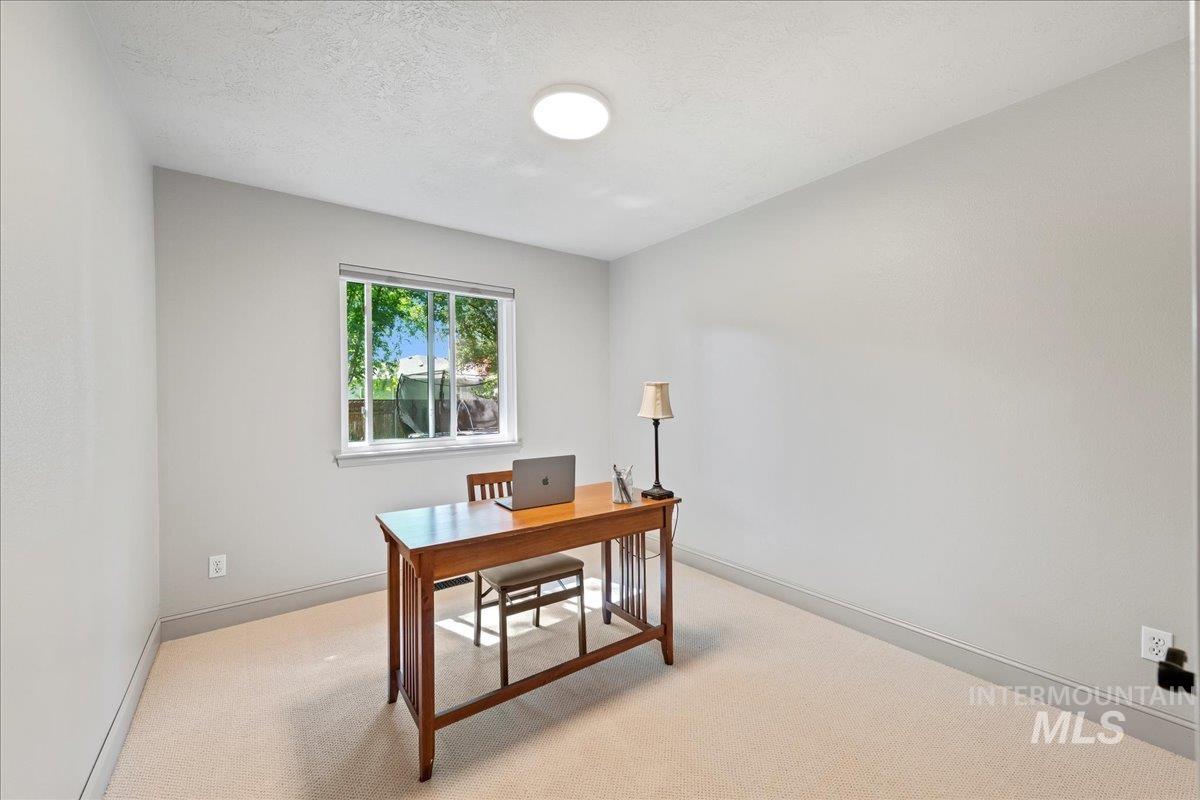 Office area with light colored carpet