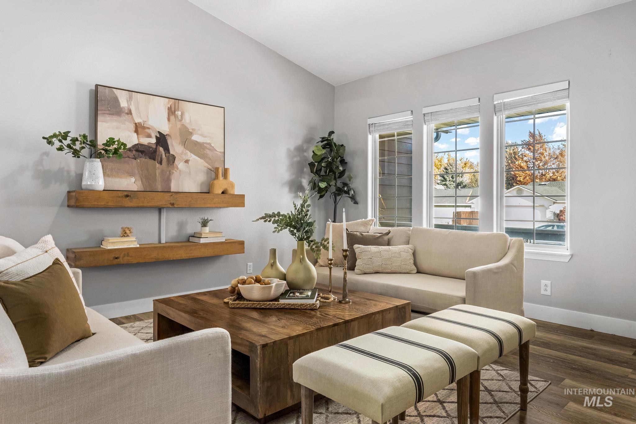 Sitting room featuring wood finished floors and baseboards