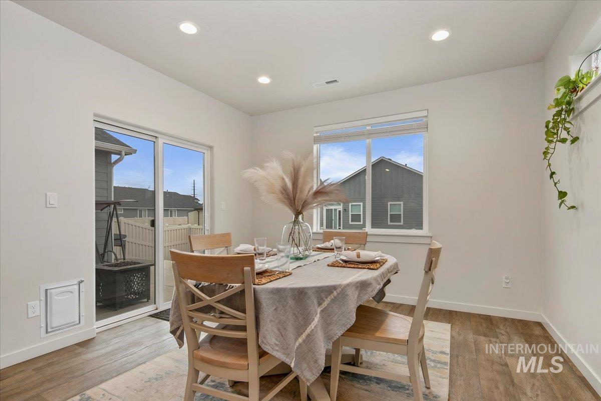 Dining area featuring recessed lighting and light wood finished floors