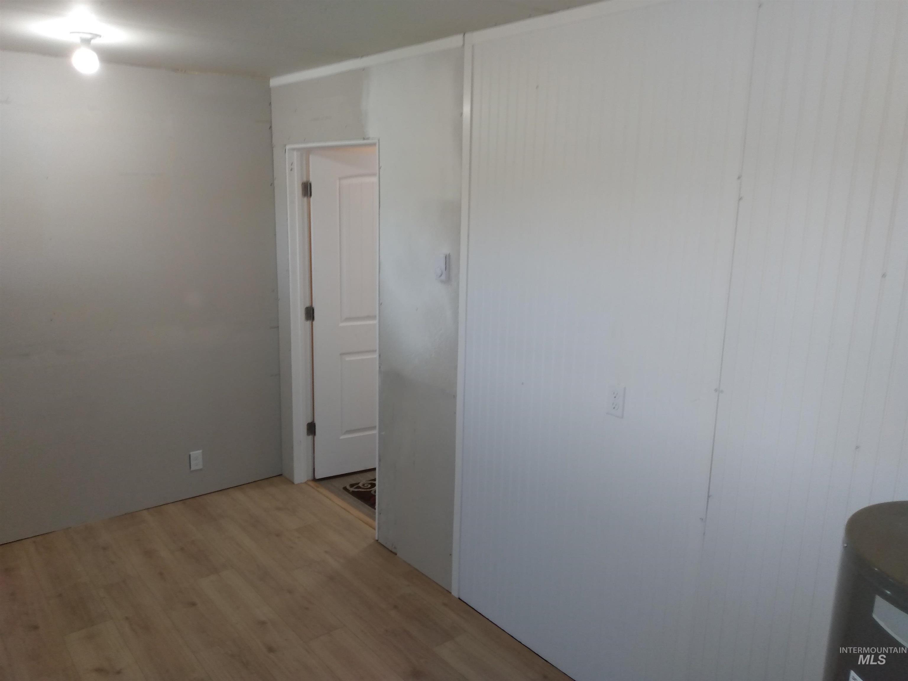 Empty room with light wood-style floors