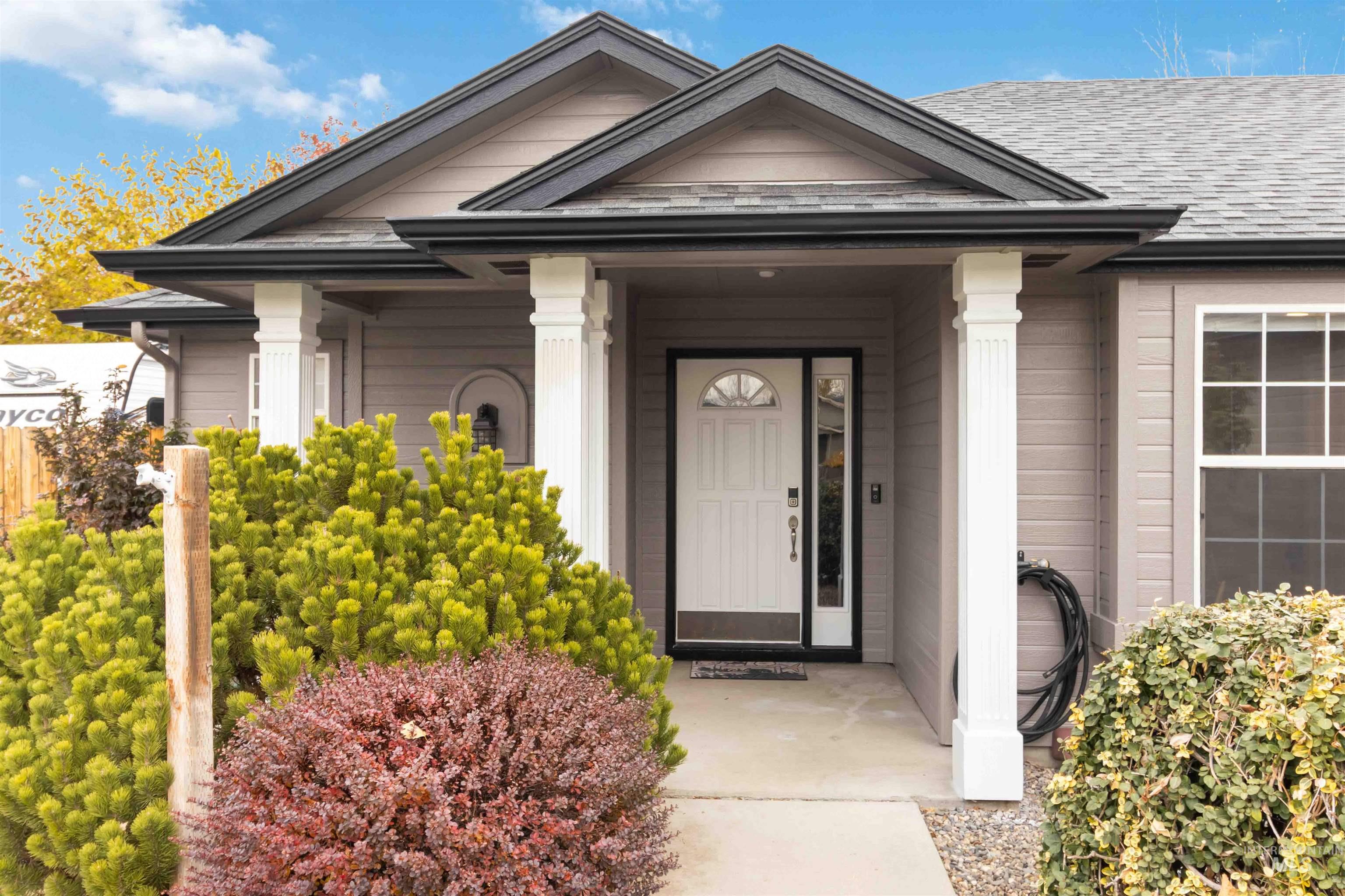 Entrance to property featuring a porch