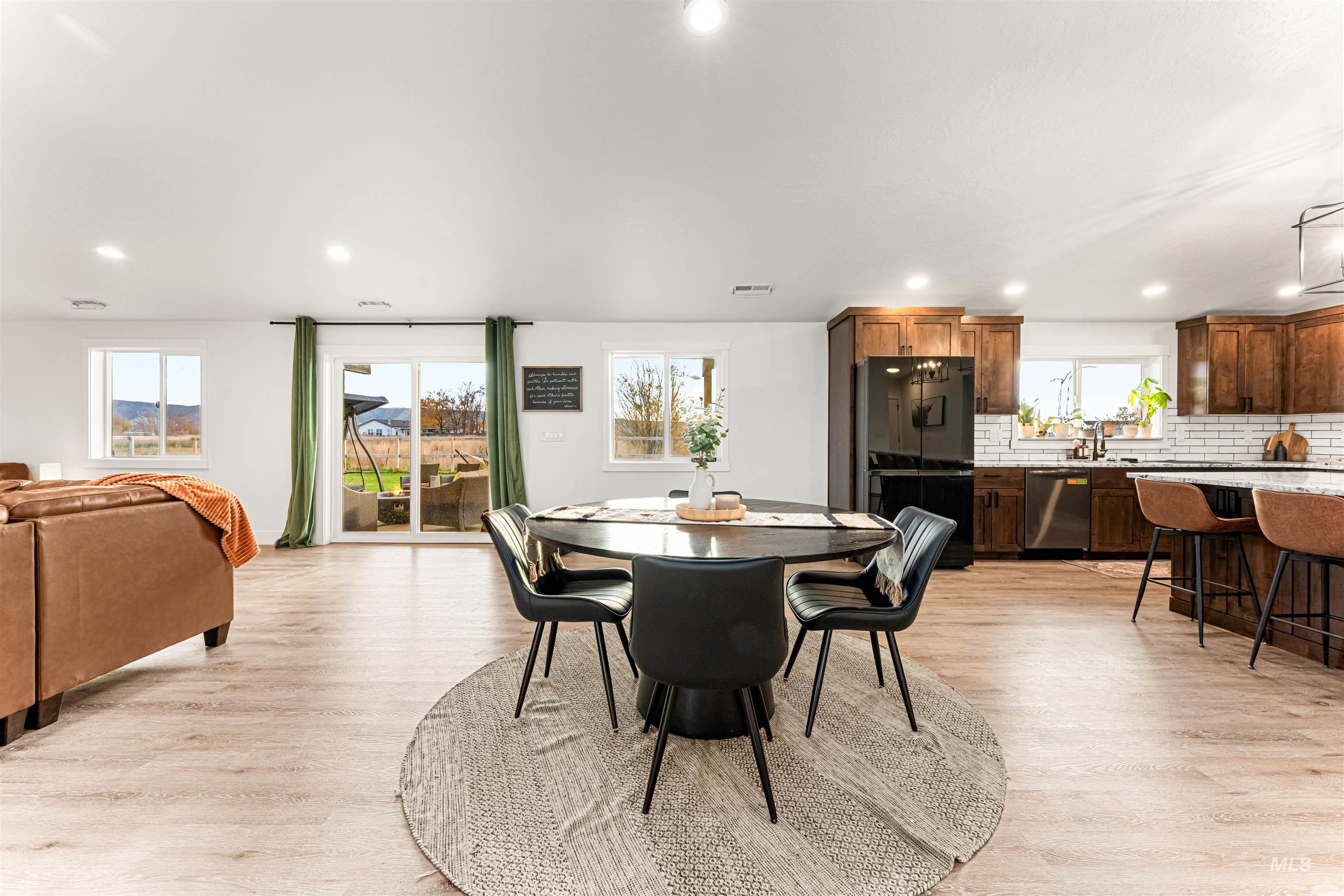 Dining area featuring light wood-style flooring and recessed lighting