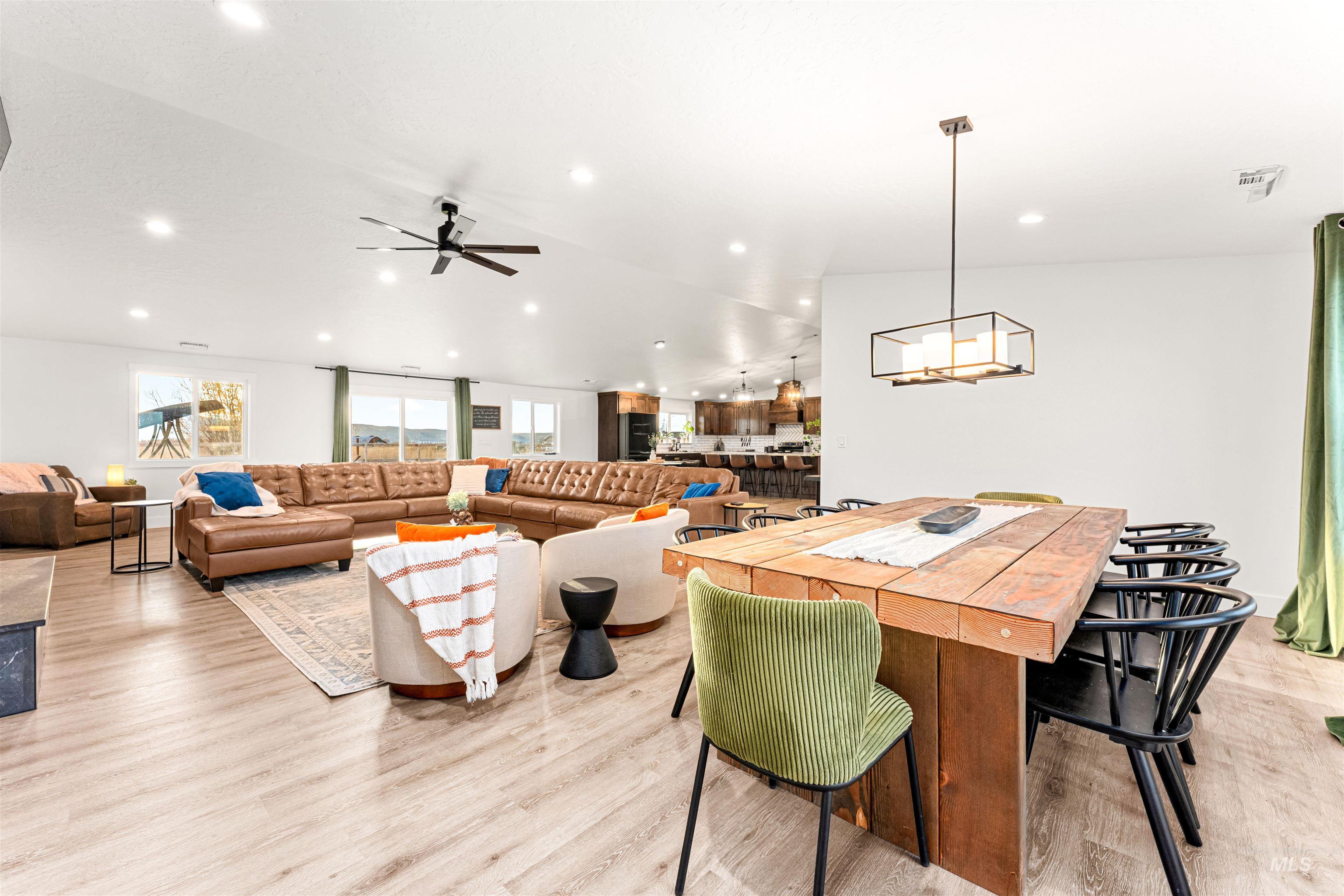 Dining area featuring light wood-style floors, recessed lighting, and a ceiling fan