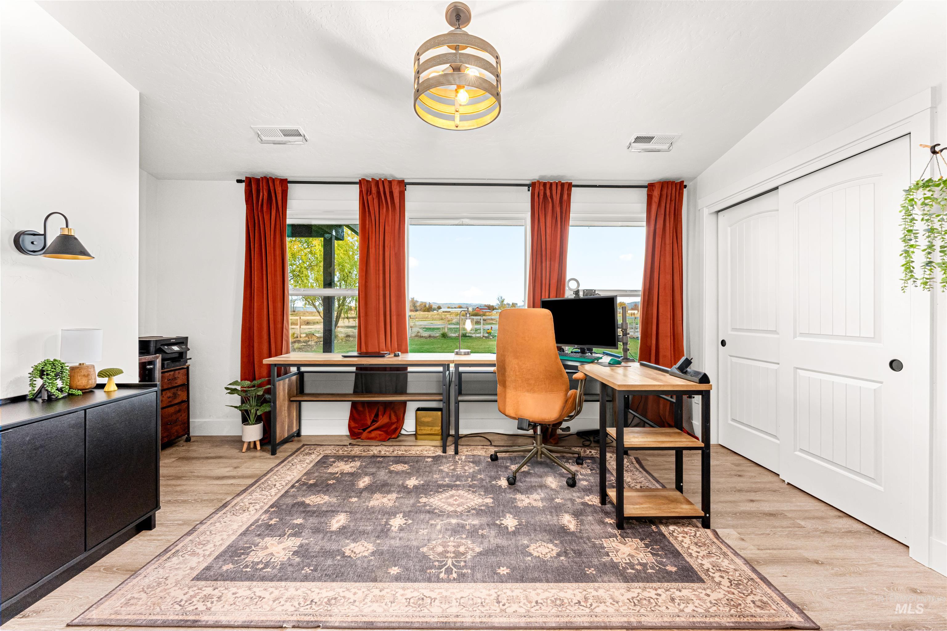 Office space featuring light wood-type flooring
