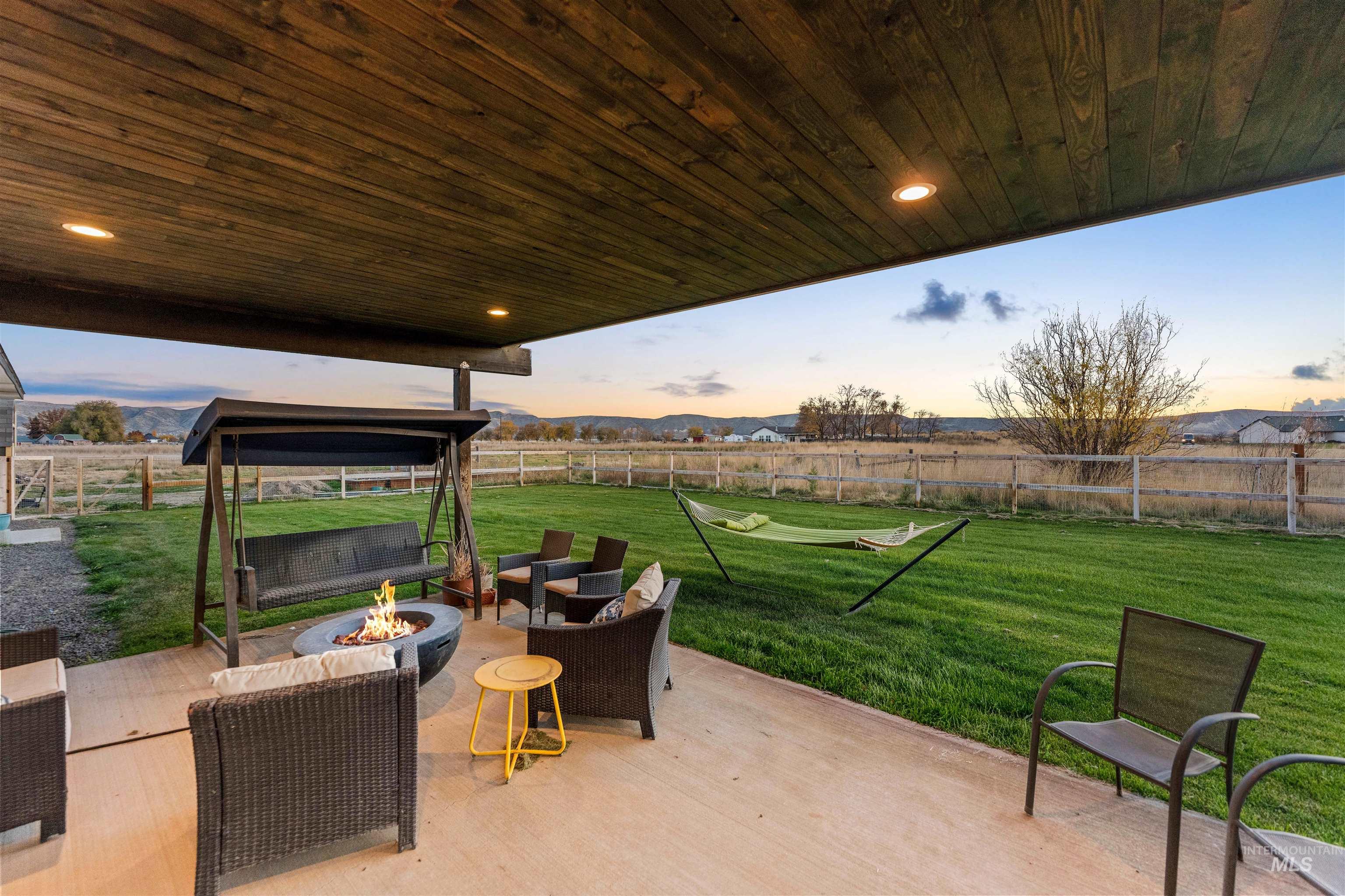 Fenced backyard with a patio area