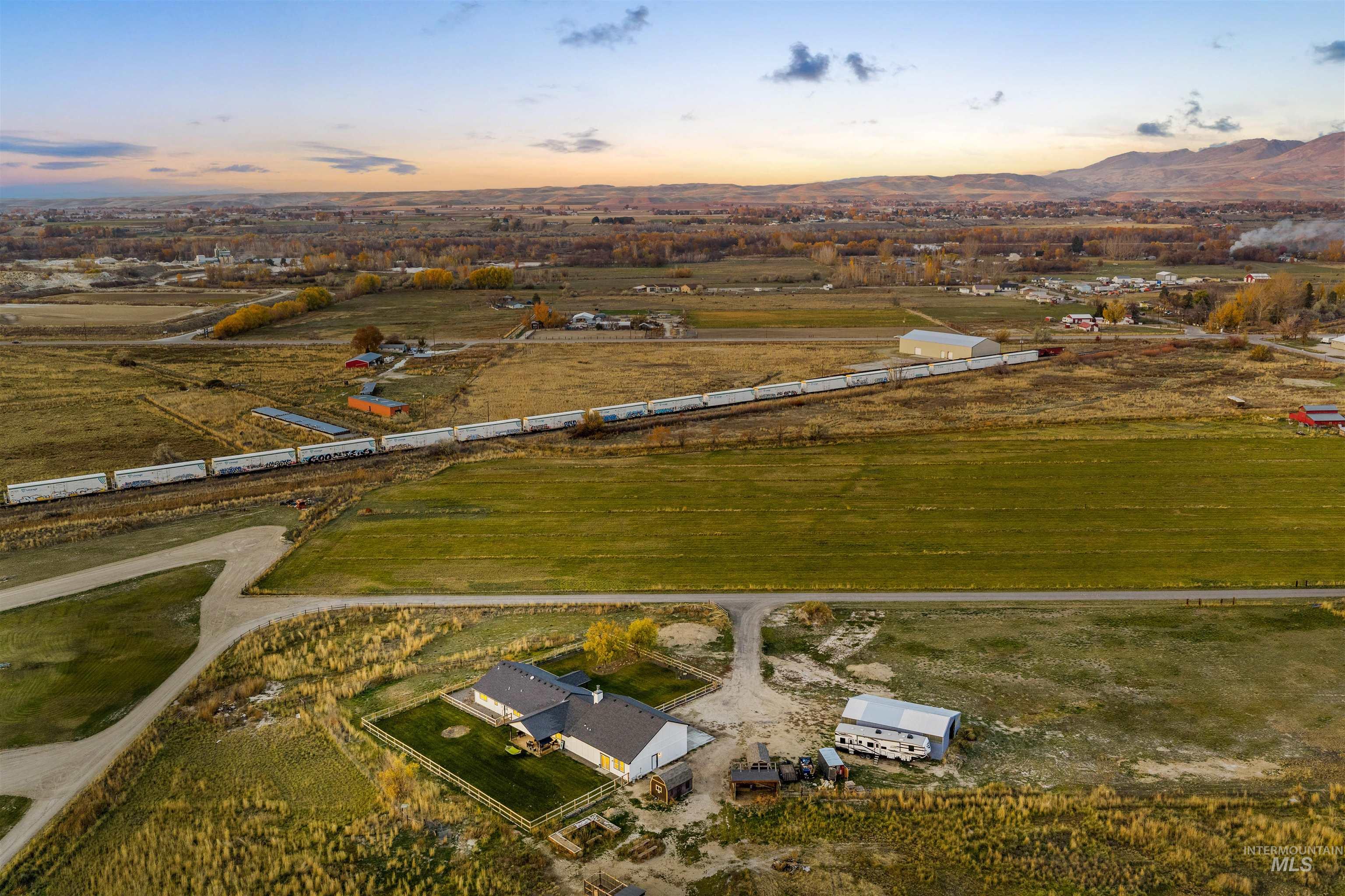 Aerial view of property and surrounding area with rural landscape