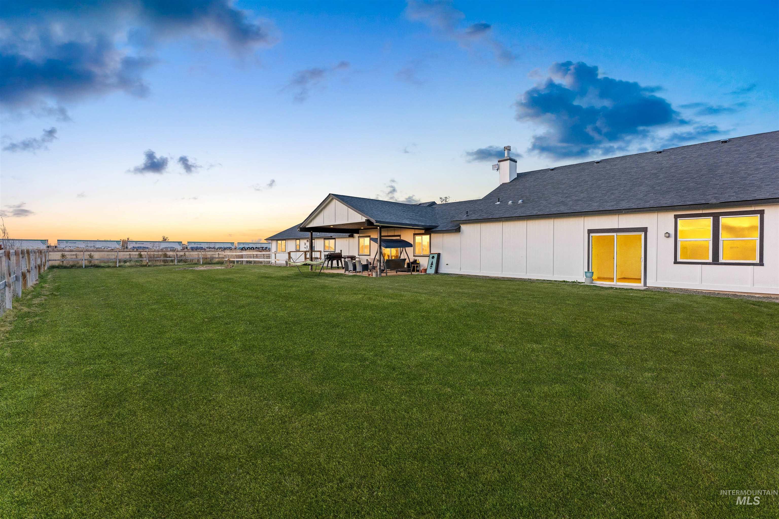 Fenced backyard with a patio area