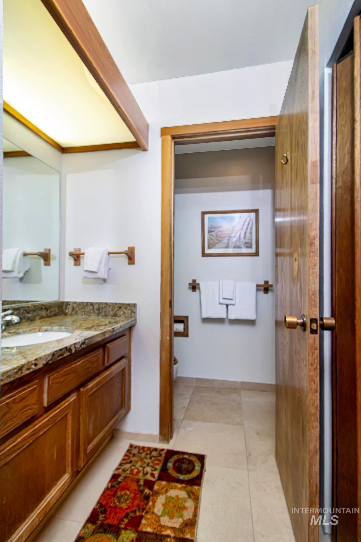 Bathroom featuring vanity and toilet