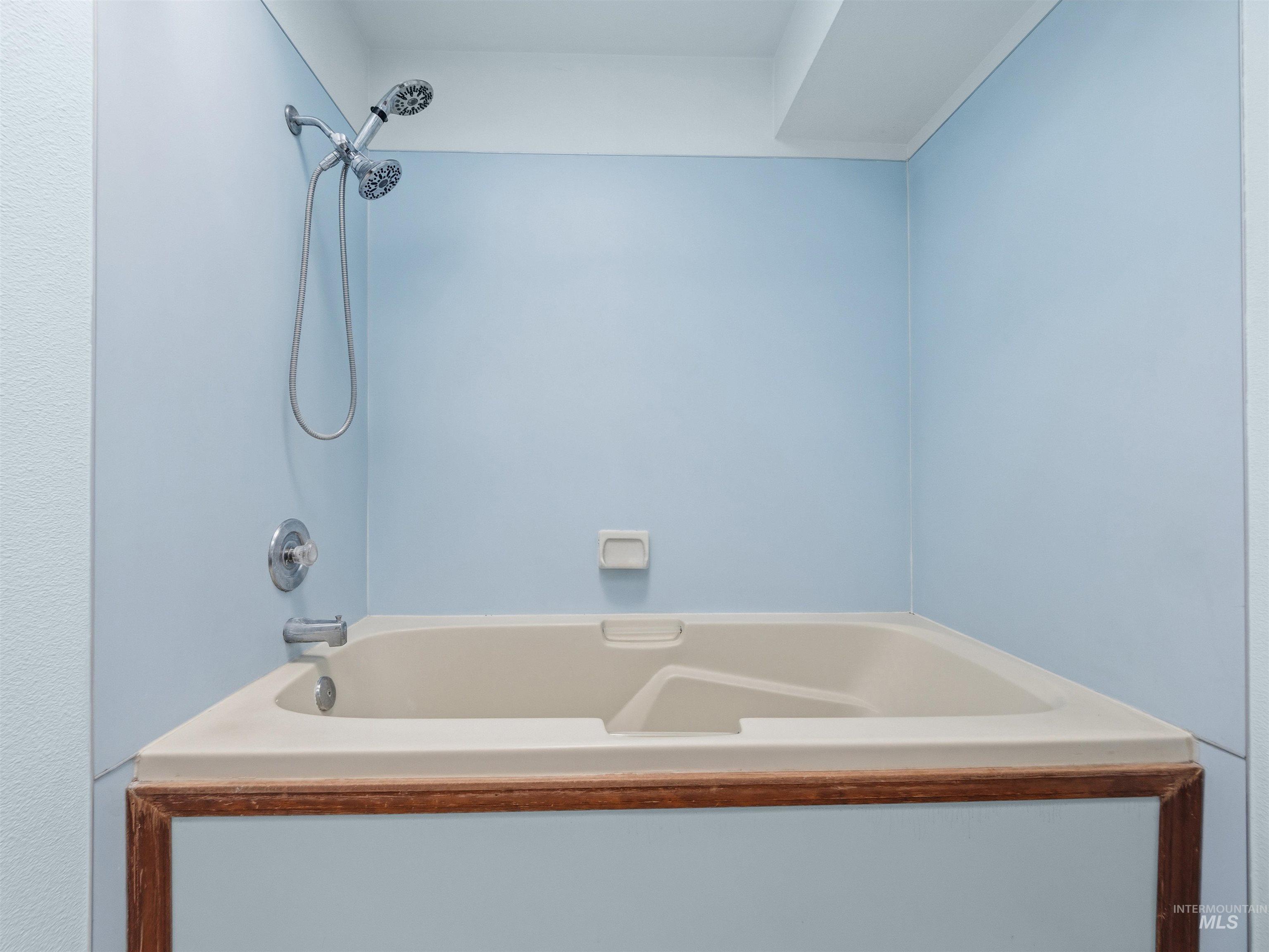 Full bathroom with shower / tub combination