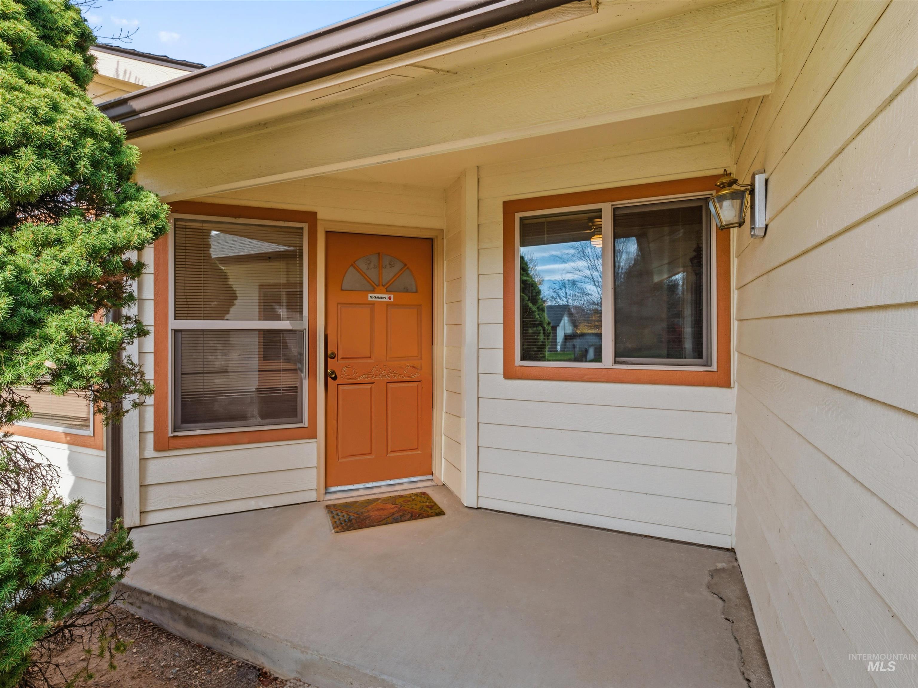 Entrance to property featuring a porch
