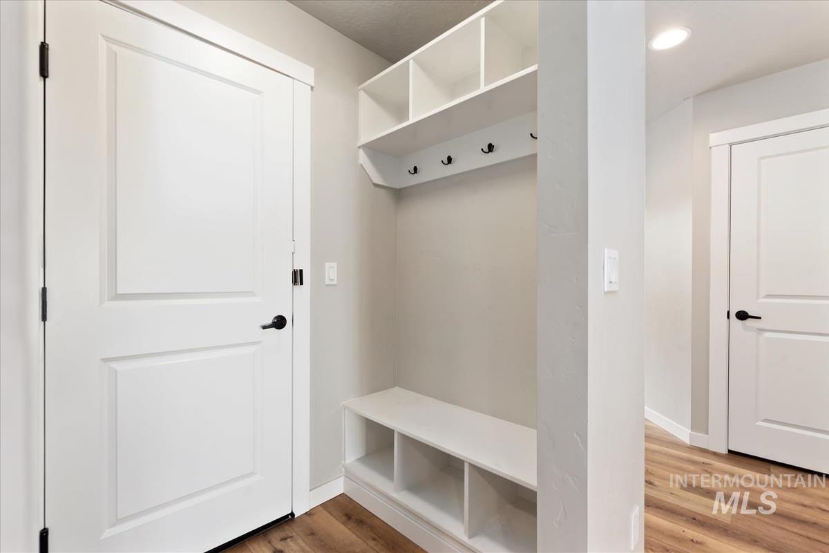 Mudroom featuring light wood-style flooring