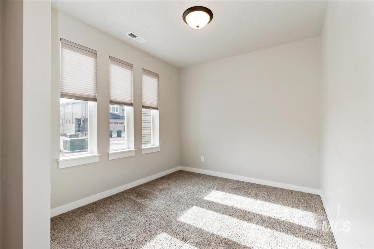 Empty room featuring carpet