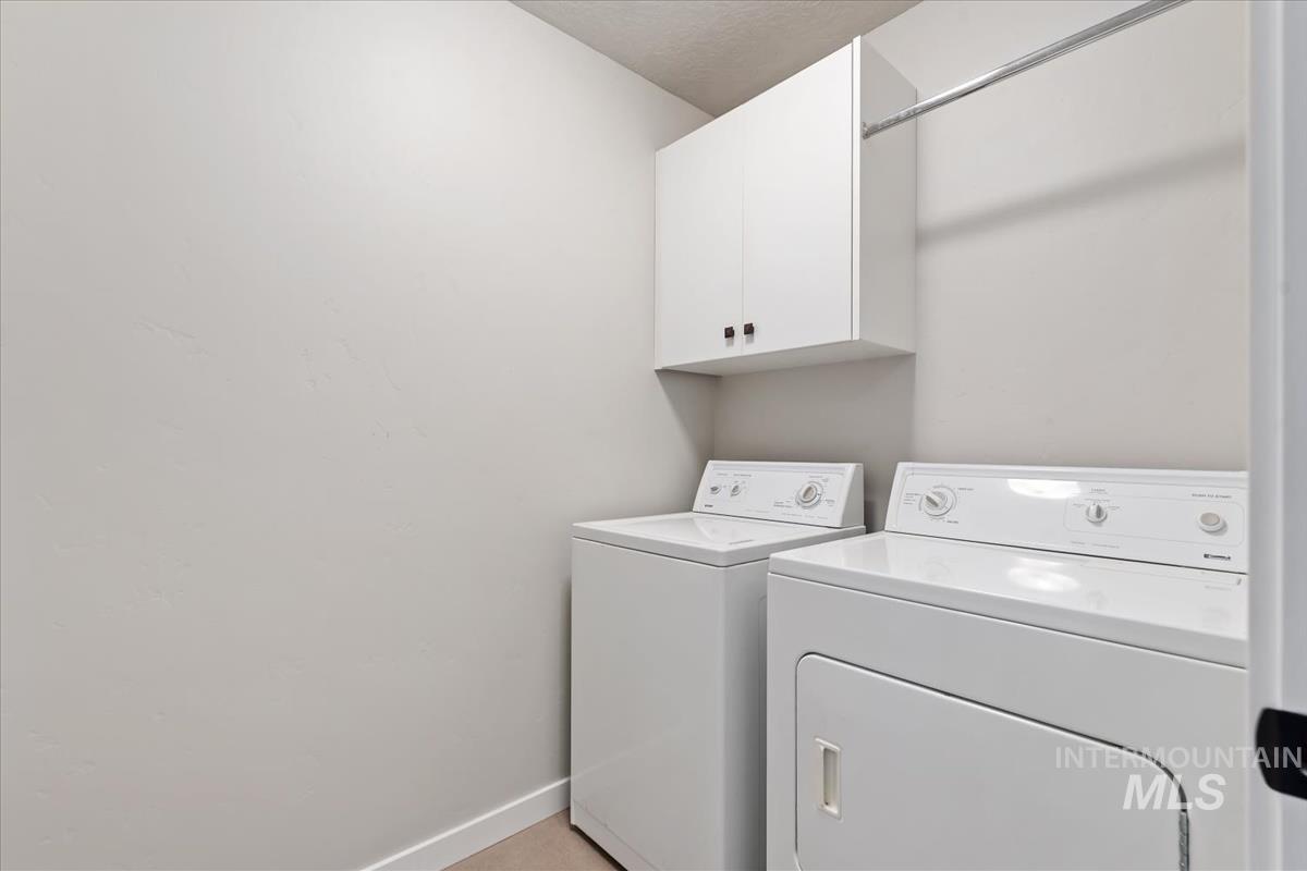 Washroom with independent washer and dryer and cabinet space