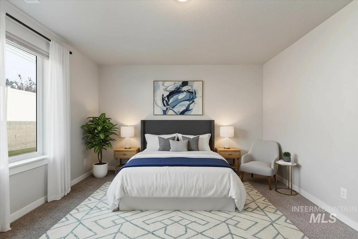 Bedroom with carpet flooring and baseboards