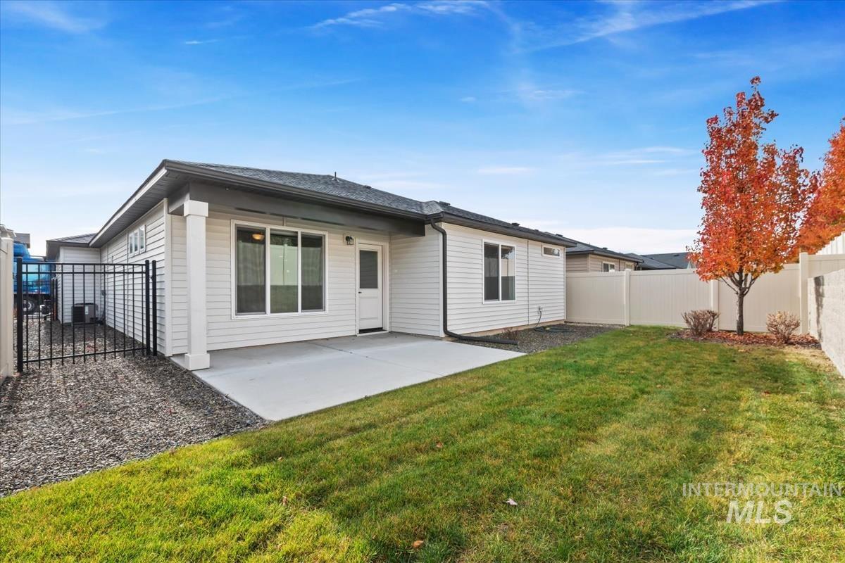 Back of property featuring a patio area and a fenced backyard