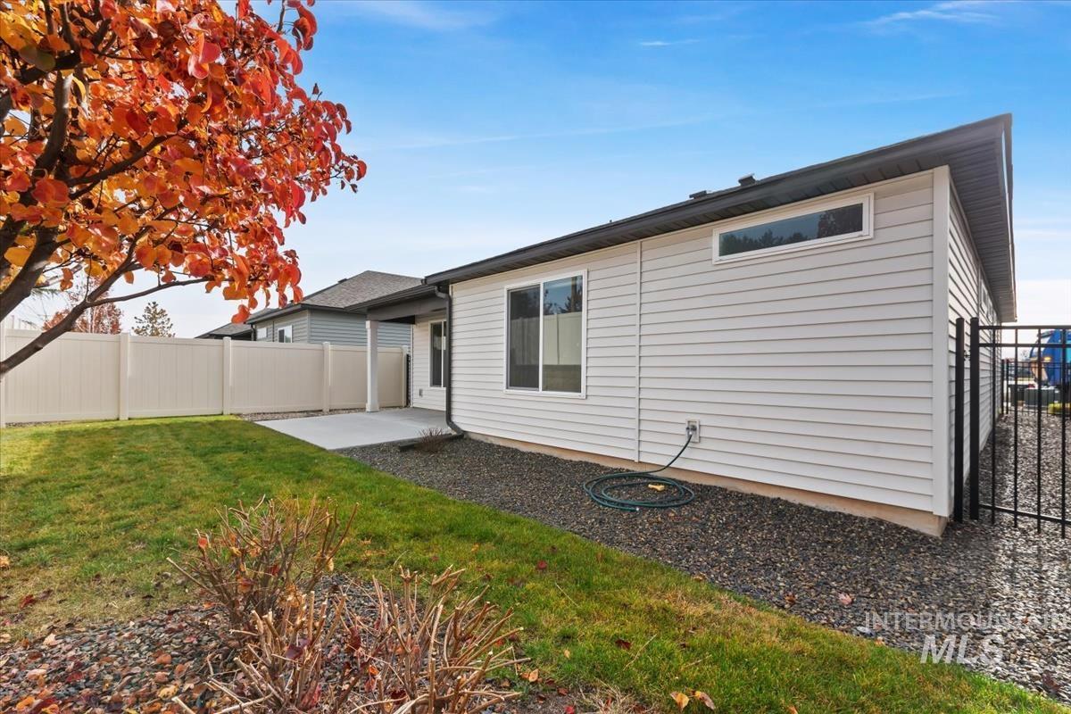 Rear view of property featuring a patio area