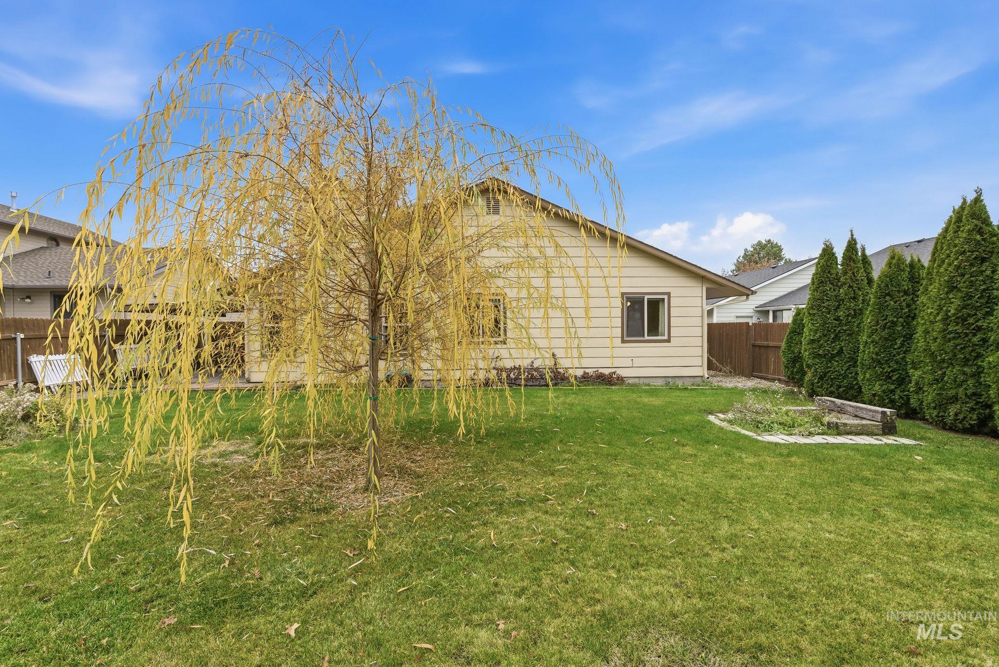 View of fenced backyard