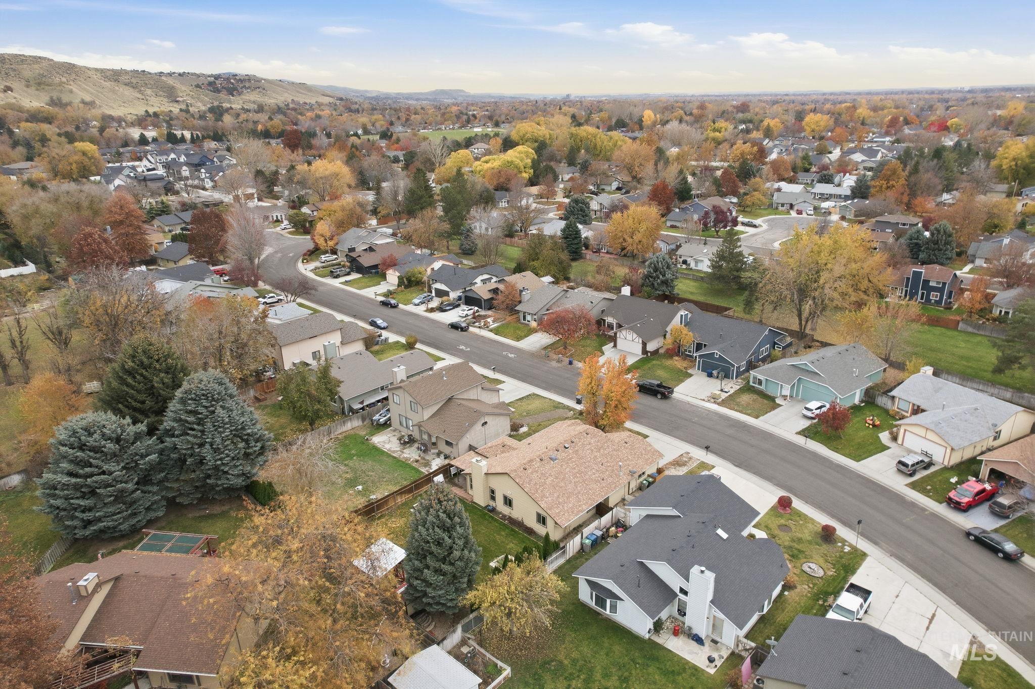 Aerial view of property's location with nearby suburban area