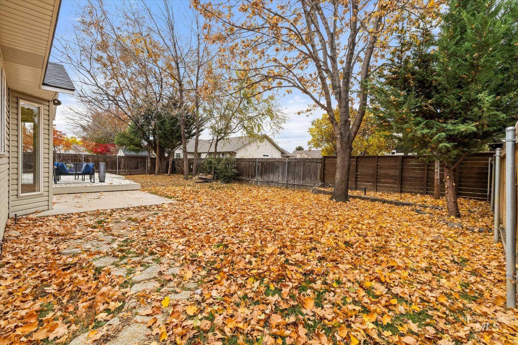Fenced backyard featuring a patio