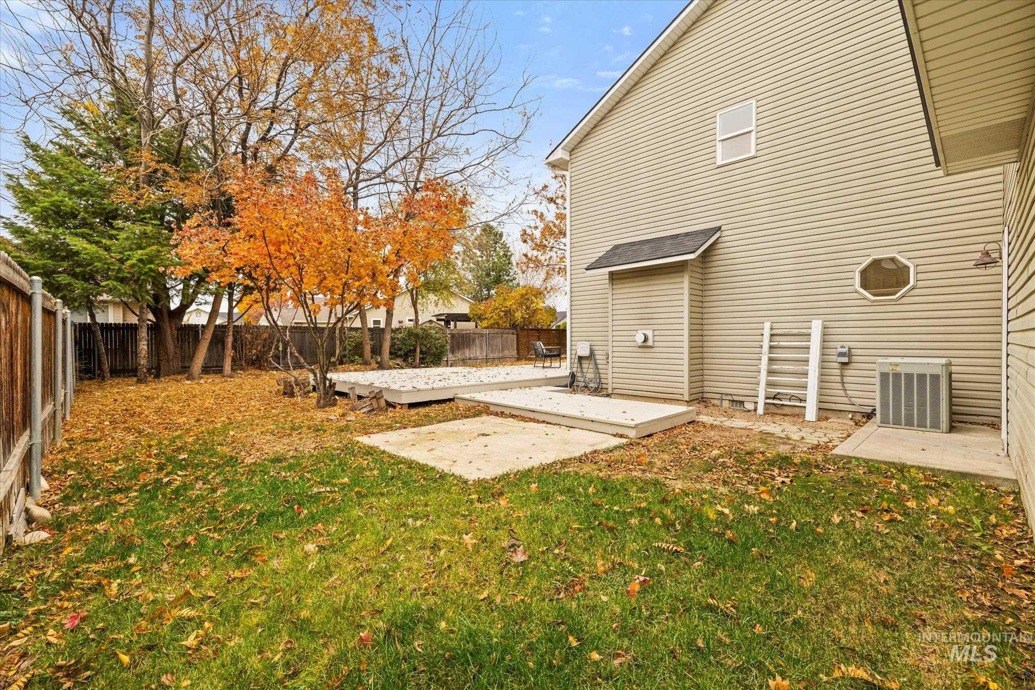 Fenced backyard with a patio area