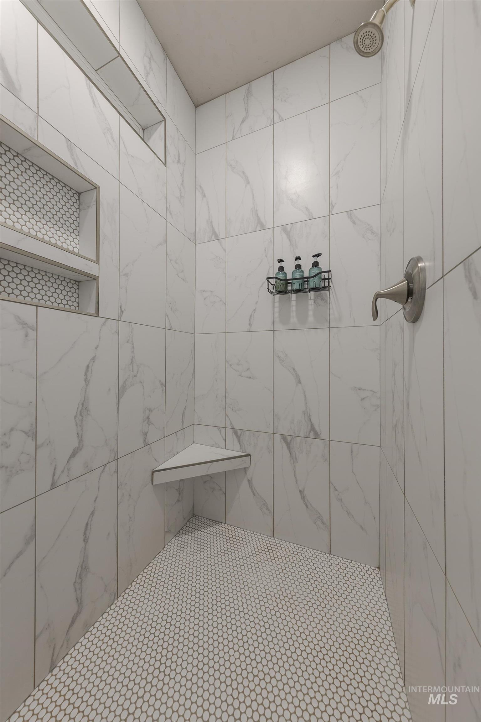Full bath with a tile shower