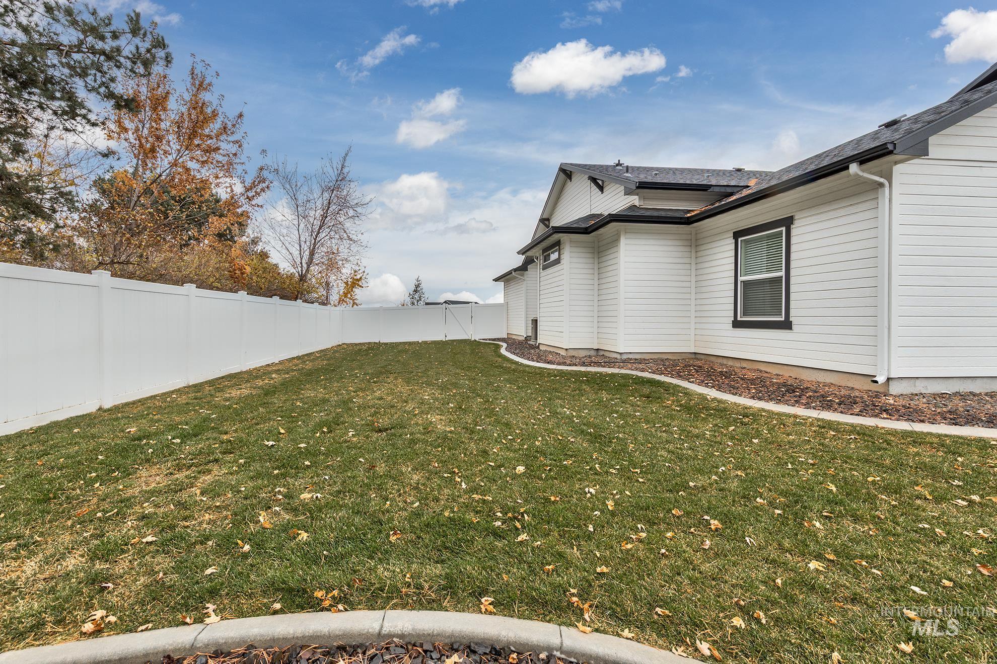 View of fenced backyard