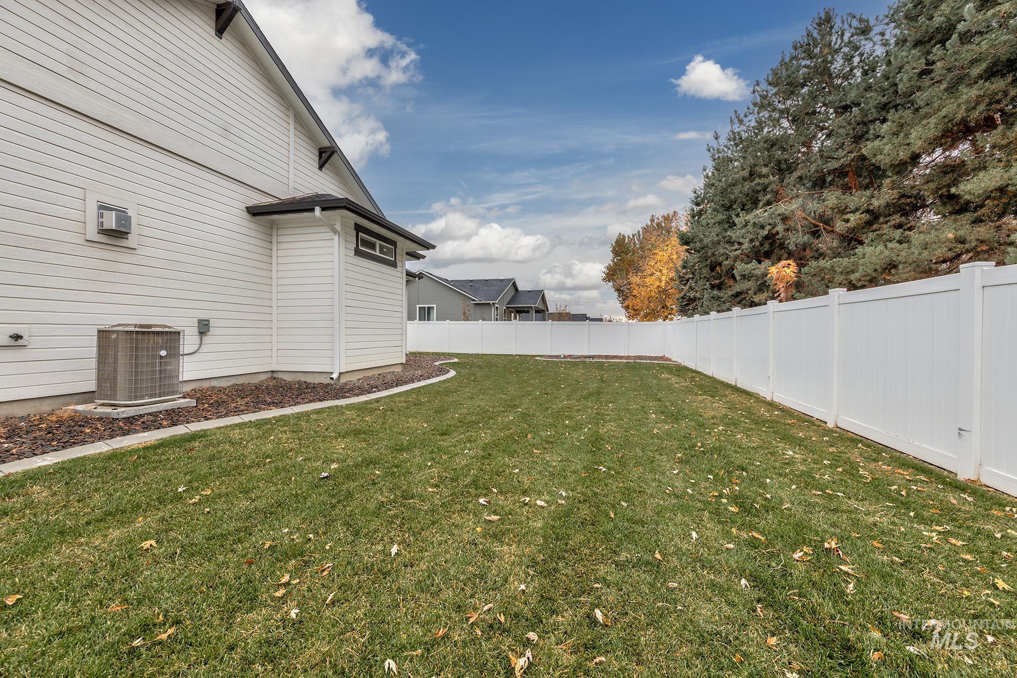 View of fenced backyard