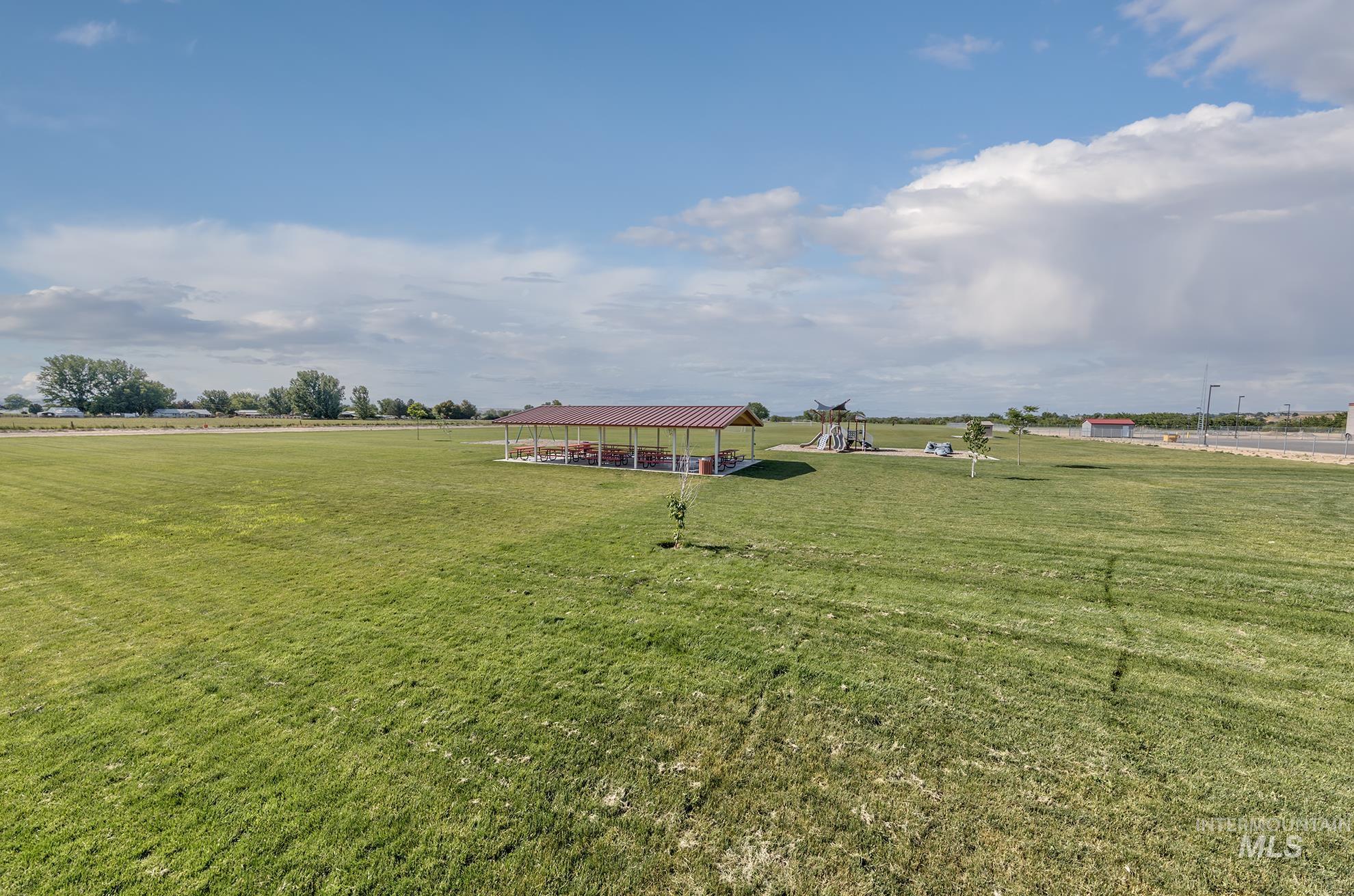 View of green lawn with a playground