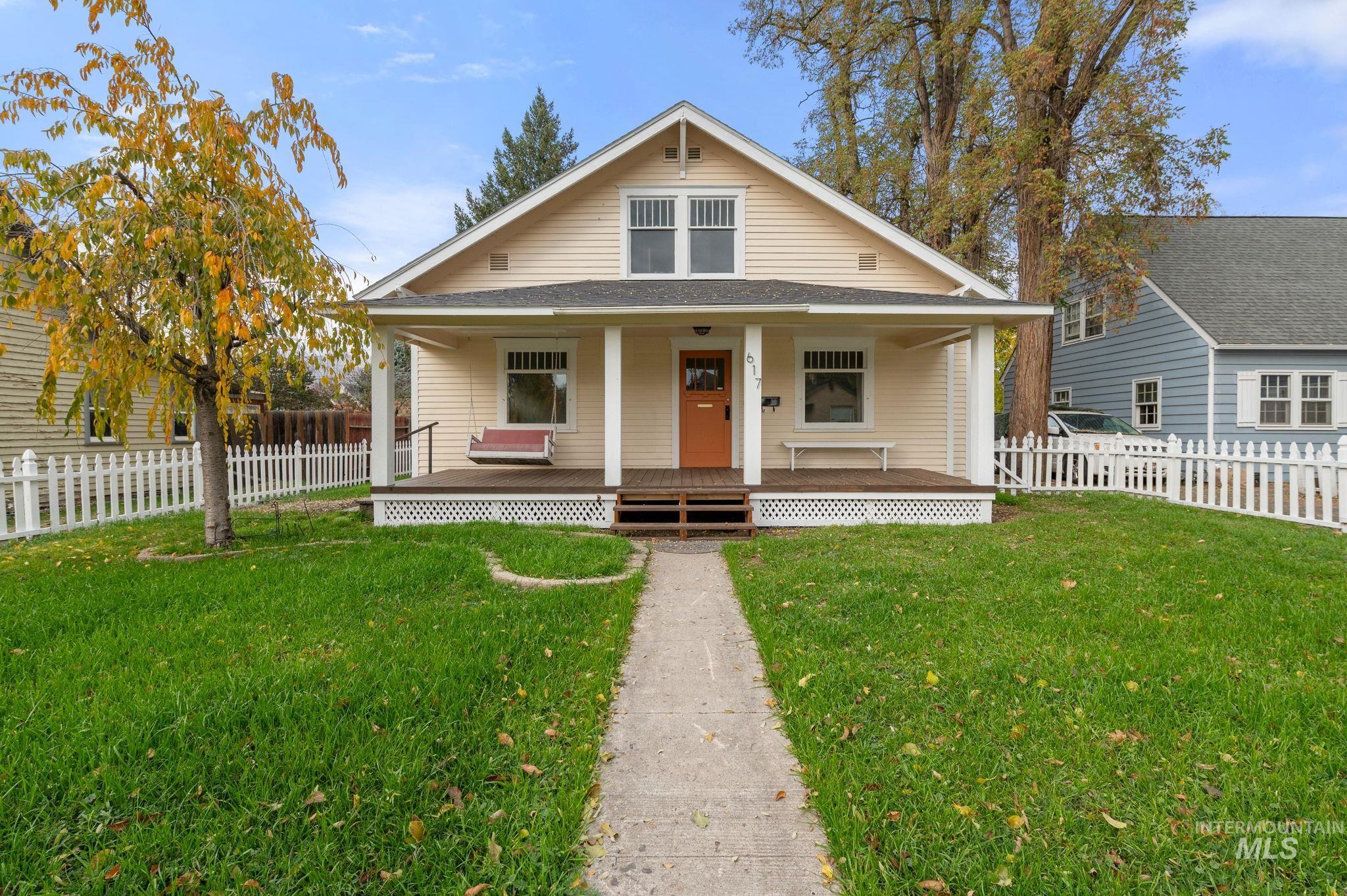 Bungalow-style home featuring covered porch and roof with shingles