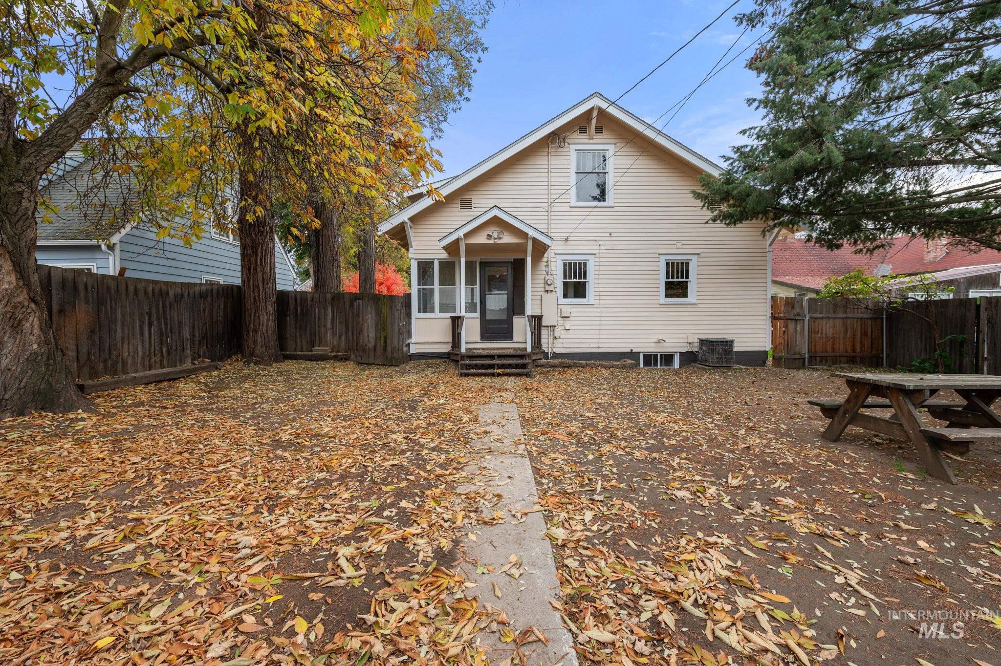 View of front facade with a fenced backyard