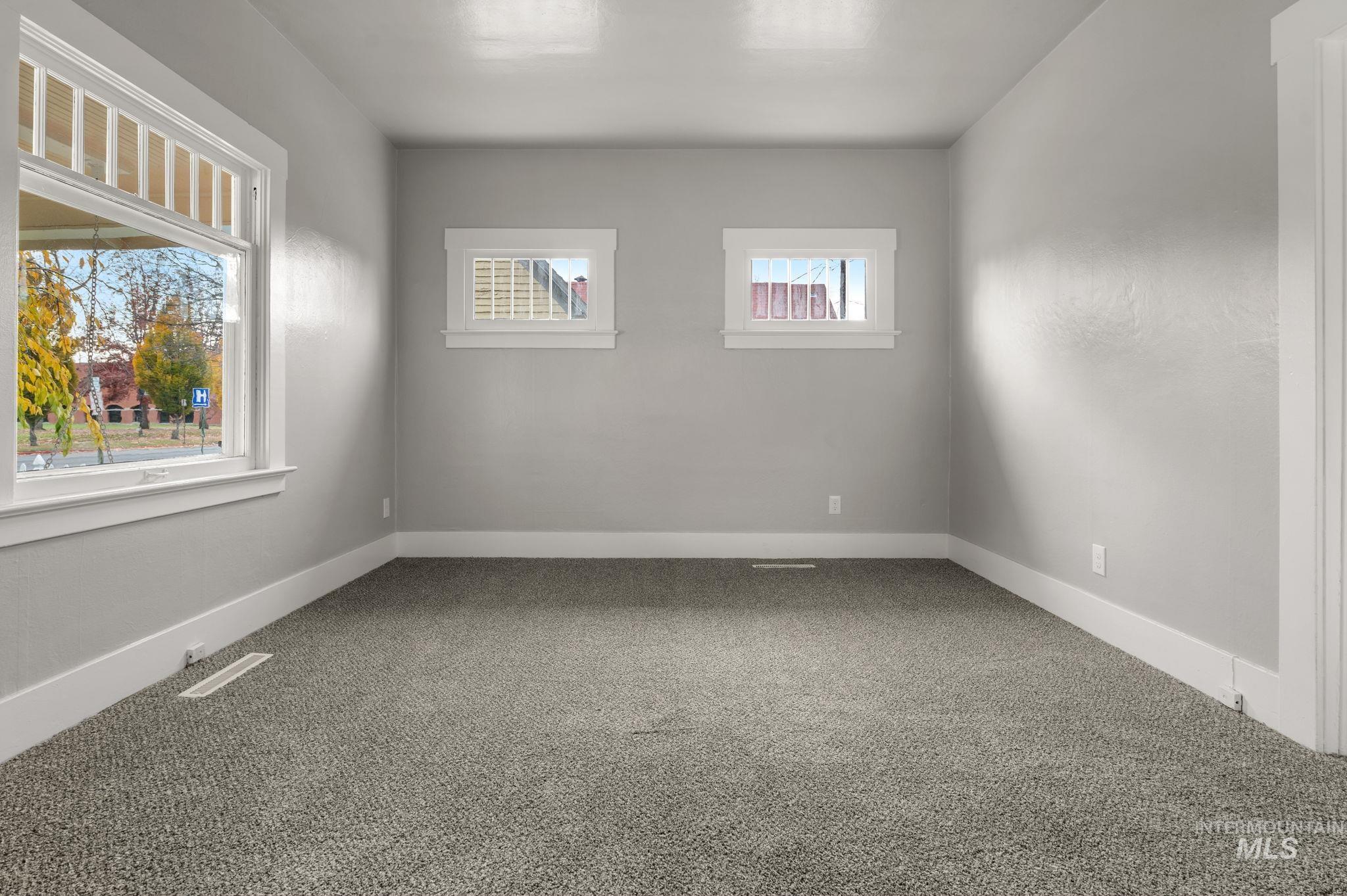 Spare room with carpet floors and baseboards