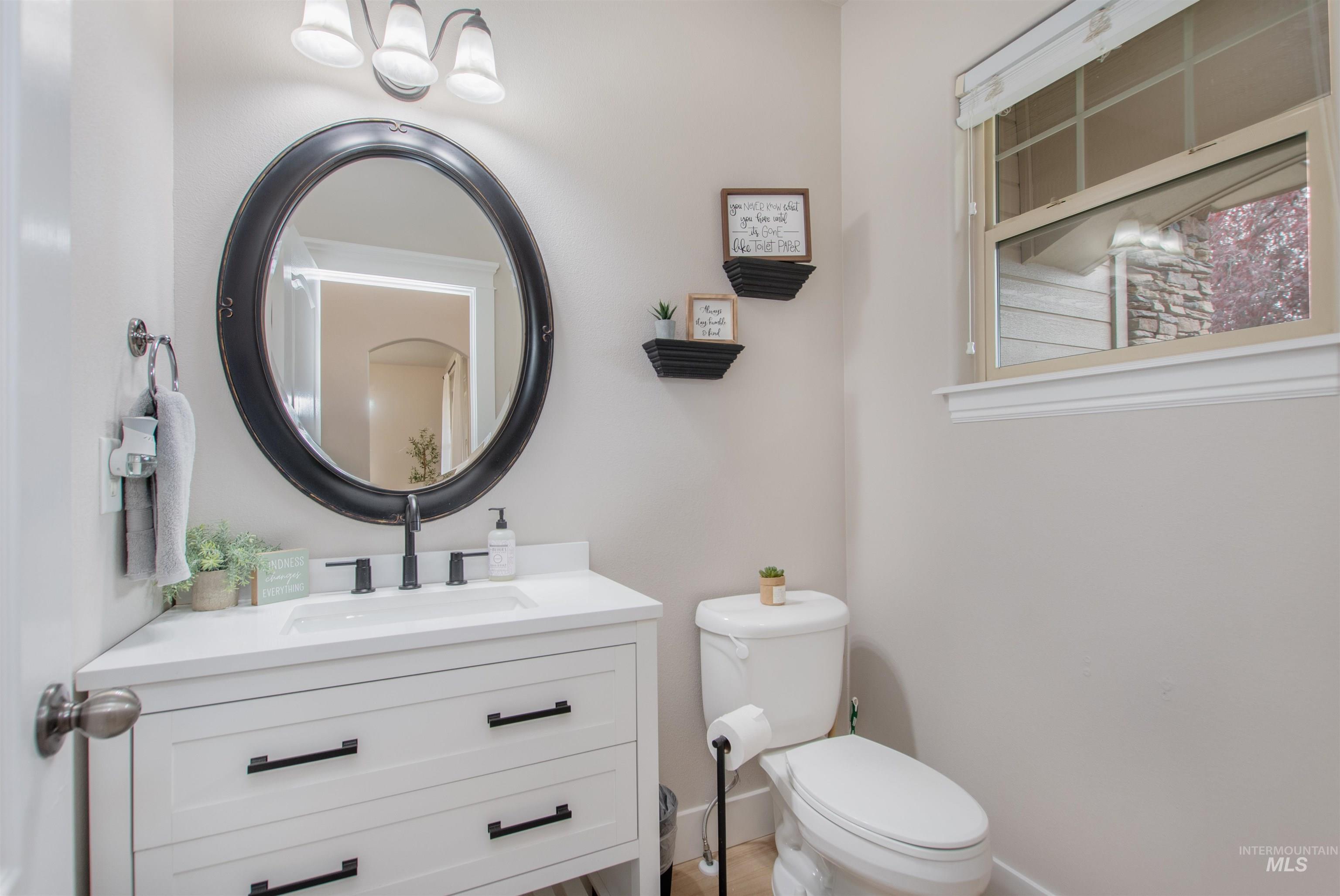 Half bath with vanity and toilet
