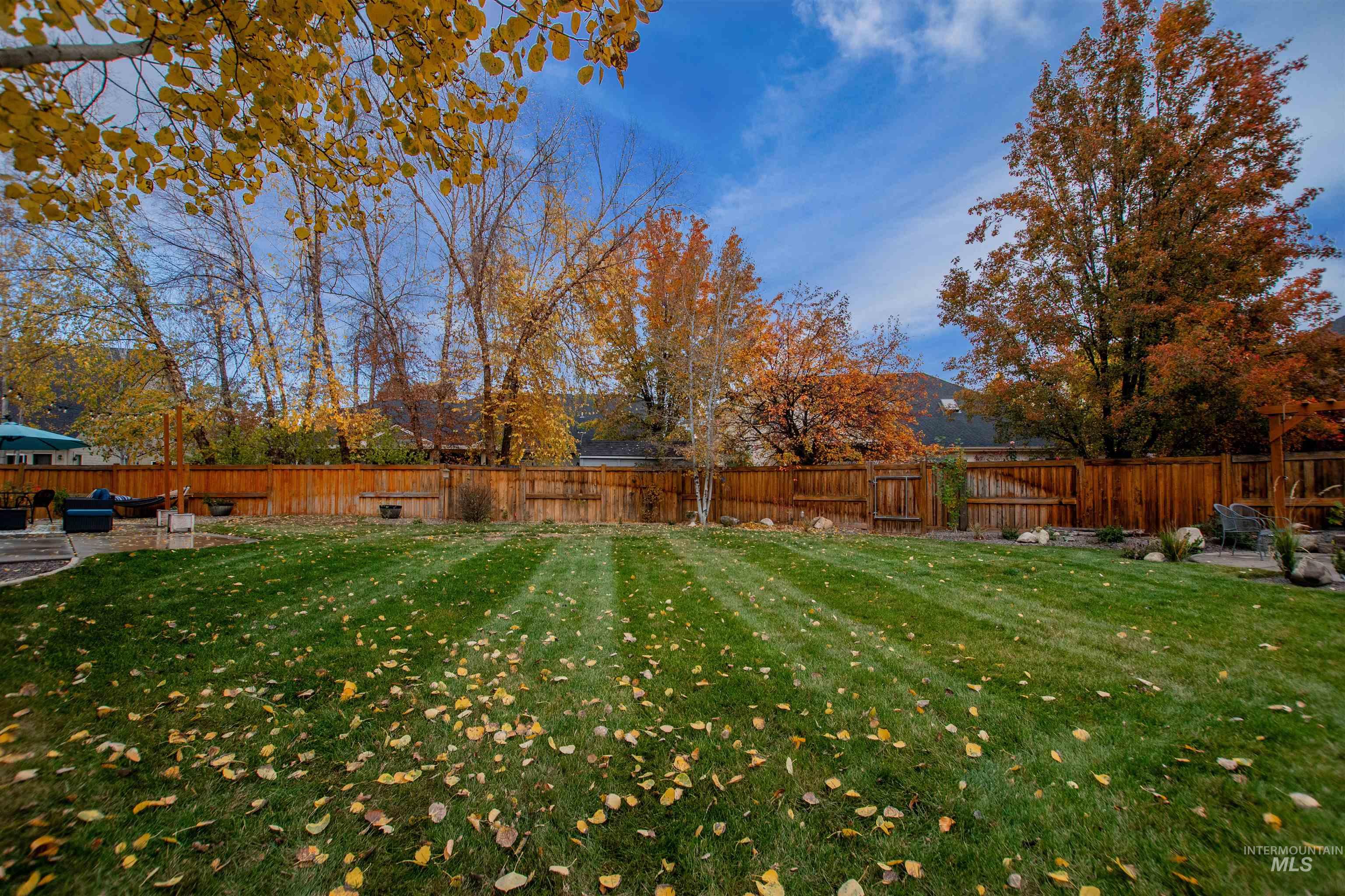Fenced backyard featuring a patio