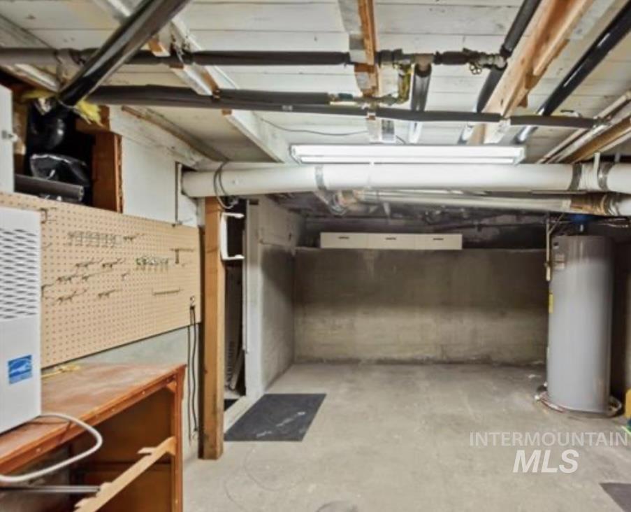 Basement featuring water heater