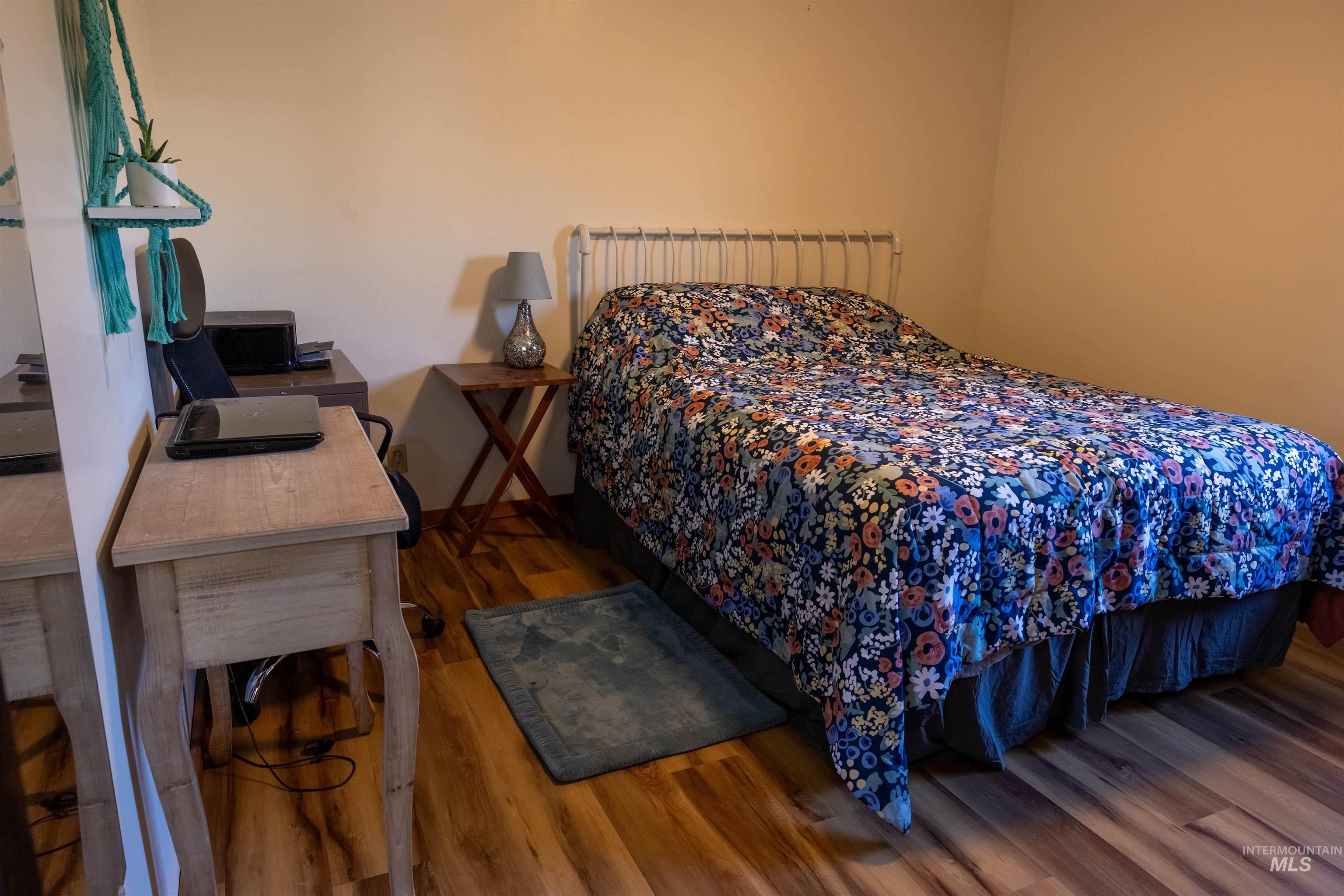 Bedroom with dark wood finished floors