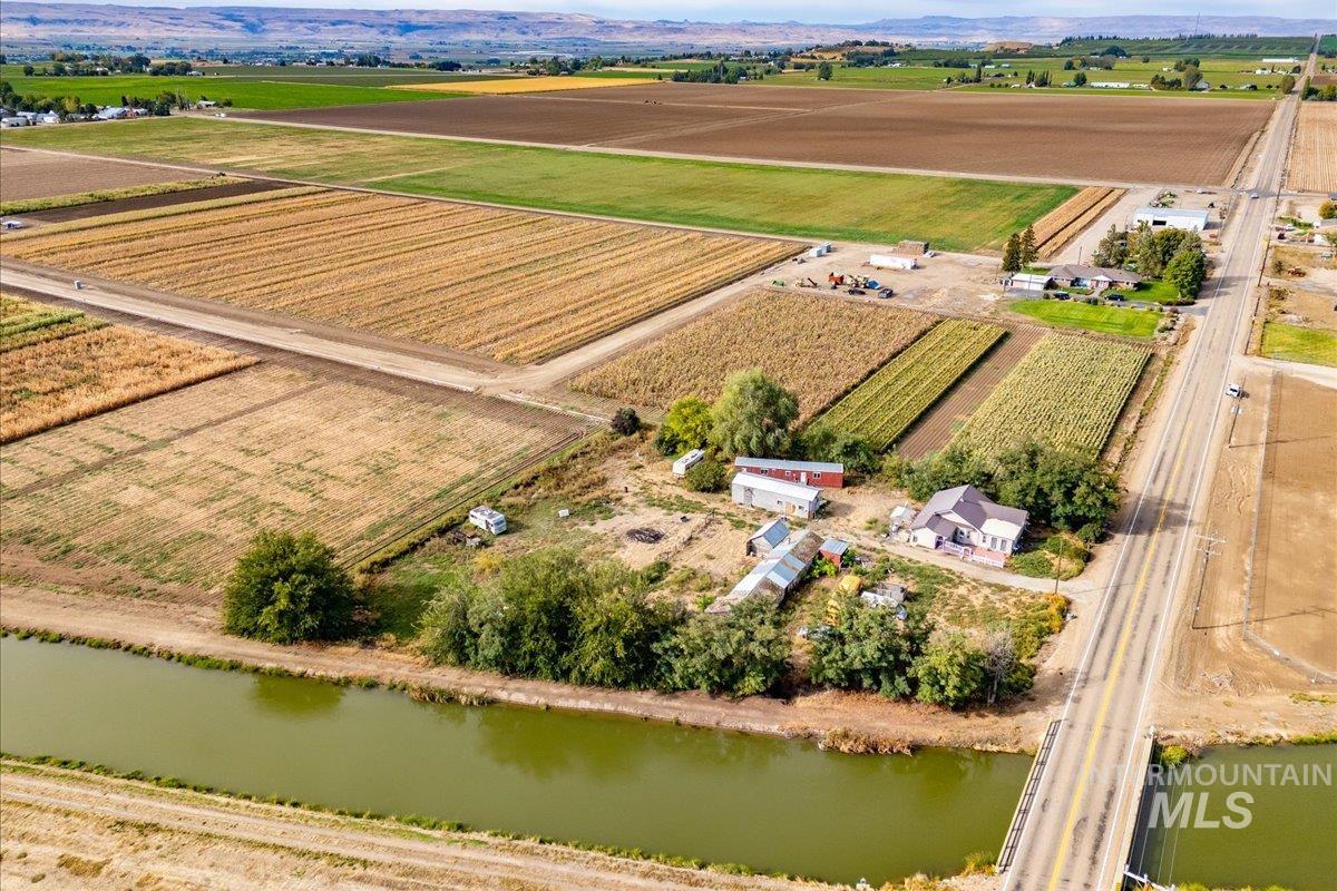 Aerial view of sparsely populated area featuring large plots for crops